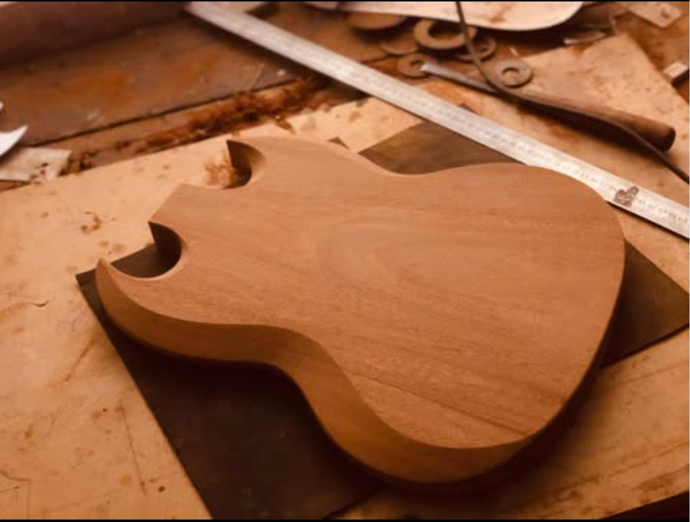 LDM Guitars workshop — handcrafted guitar body in progress